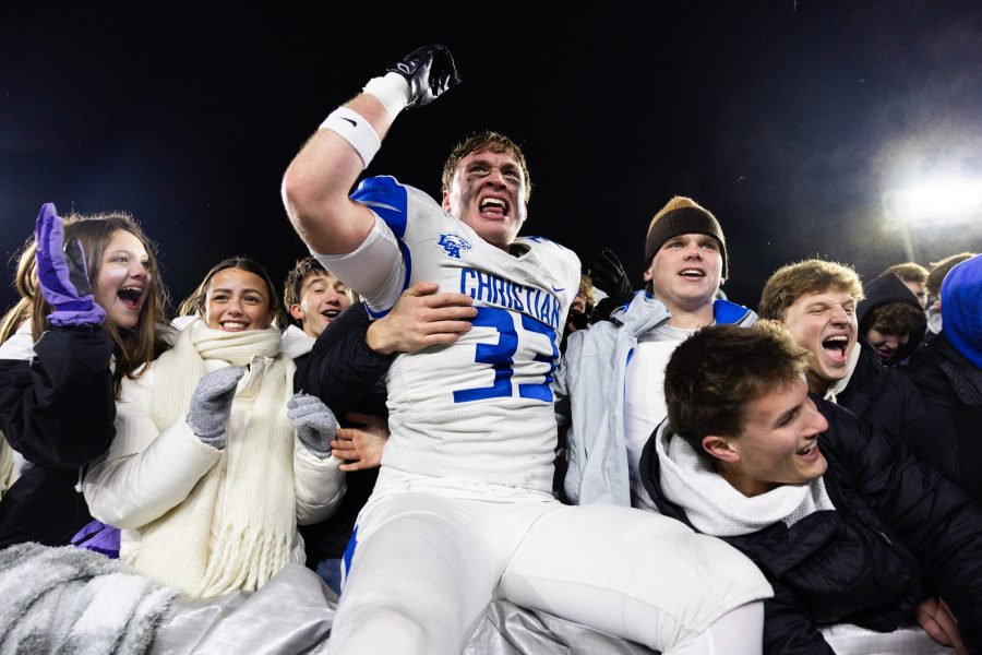 Mac Darland of Lexington Christian celebrates with fans in the stands after winning the 2A state title (Breven Walker | 10thRegion.com).