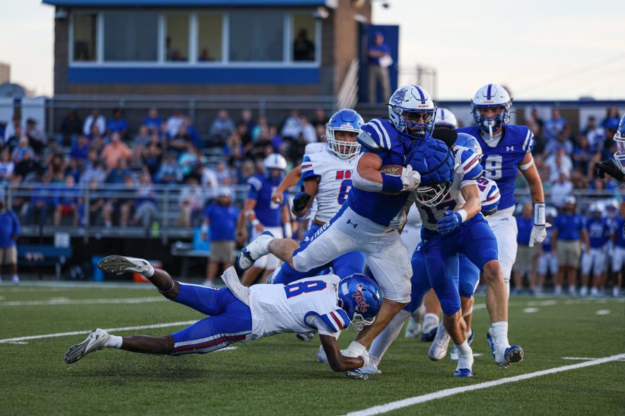 Joey Staggs of Mason County is tackled by a a couple Montgomery County players (Will Jones).