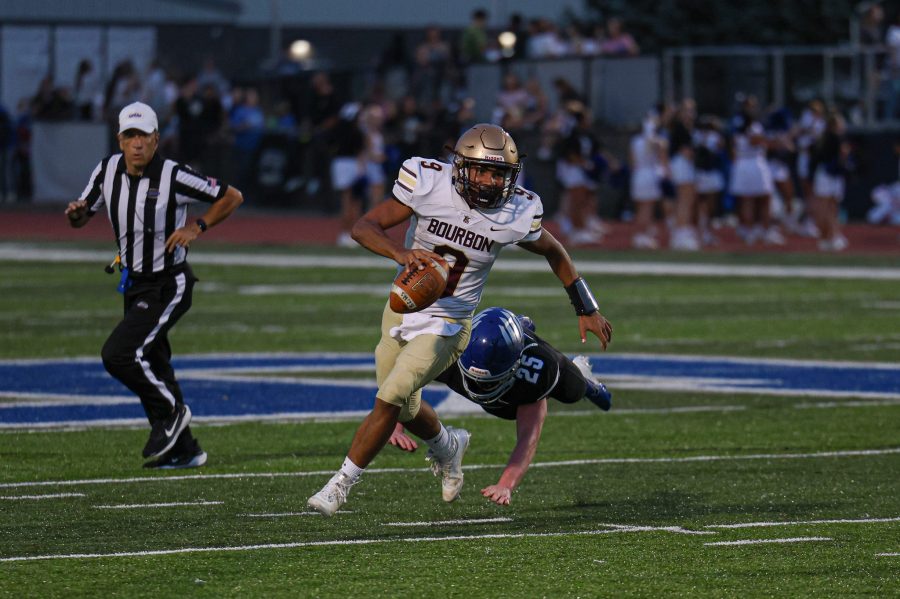 Bourbon County QB Malachi Rennie breaks away from Scott defender (Will Jones).