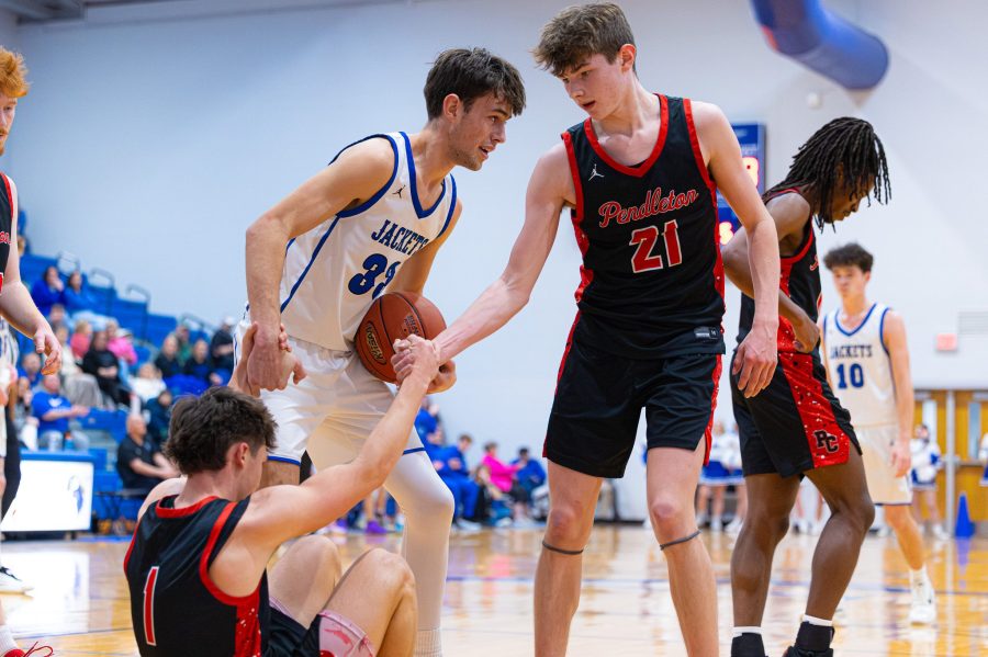 Caiden Smith of Nicholas County and Kamden O'Hara of Pendleton County help Dawson Nichols up after a play on Feb. 14, 2026 in Carlisle, KY.