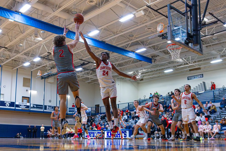 Jacob Spurlock of Boyd County shoots over DeAndre Watkins of Daviess County in the finals of the 2025 WGM Holiday Classic.